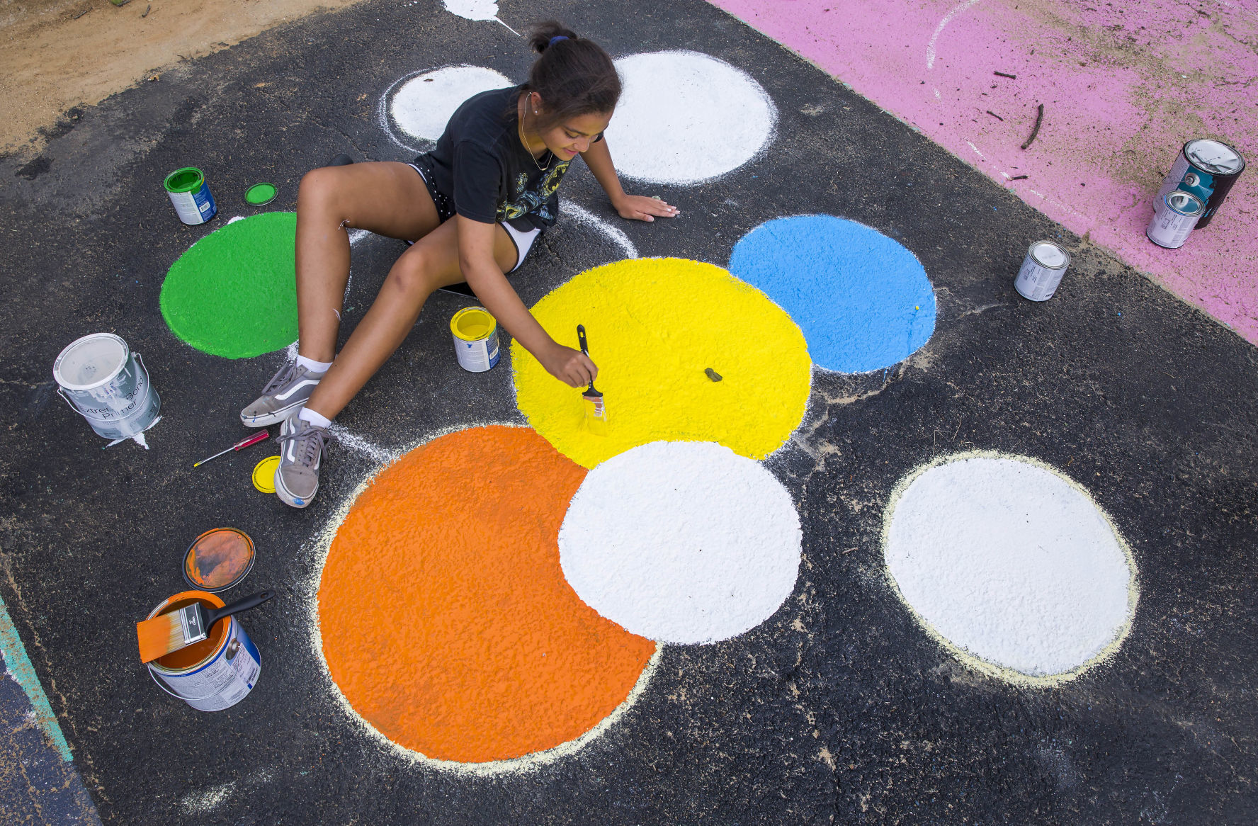 Students painting their parking spaces
